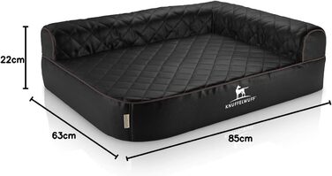 Ортопедичне кутове ліжко для собак Knuffelwuff Winslow з чорного лазерно-прошитого штучного шкіряного покриття, розмір L 85 x 63 см, збірна спинка, знімний чохол, легко миється, підходить для великих, середніх та малих собак. Розміри: 85 x 63 x 22 см.